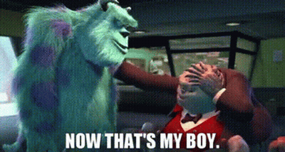 A Monster From The Movie Monsters Inc Is Standing Next To A Man In A Tuxedo . GIF