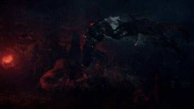 A Monster Is Fighting Another Monster In A Dark Scene GIF