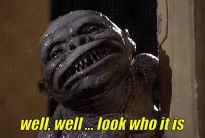 A Monster Is Standing In A Doorway And Says `` Well , Well , Look Who It Is '' . GIF