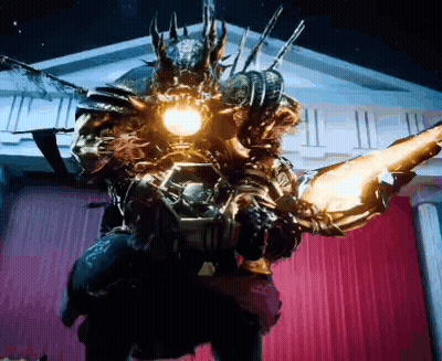 A Monster Is Standing In Front Of A Building With A Red Curtain And A Light On It 'S Head . GIF