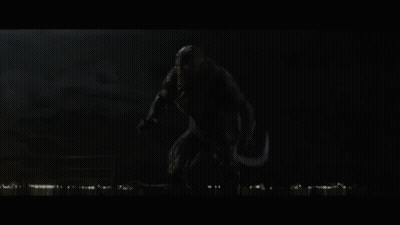A Monster With Its Mouth Open In The Dark GIF