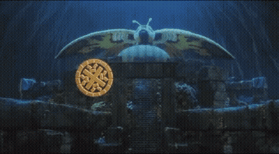 A Mothra Logo With A Moth On Top Of It GIF
