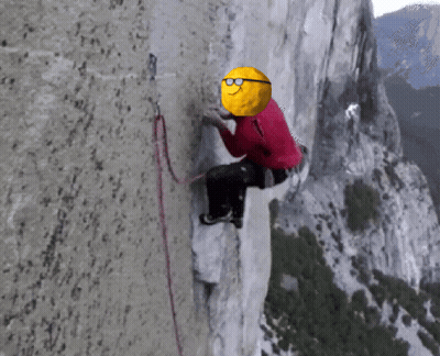 A Mountain Climber With A Yellow Ball On His Head GIF