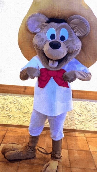 A Mouse Mascot Wearing A White Shirt And A Red Bow Tie GIF