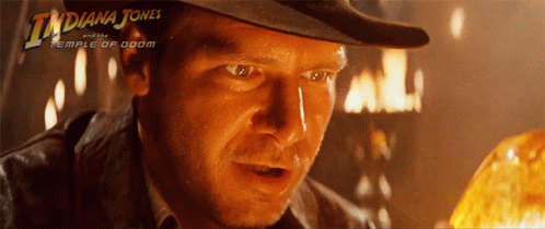 A Movie Poster For Indiana Jones And The Temple Of Doom Shows A Man In A Hat GIF