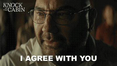 A Movie Poster For Knock At The Cabin Shows A Man With Glasses Saying I Agree With You GIF