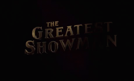 A Movie Poster For The Greatest Showman With A Black Background GIF