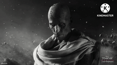 A Movie Poster For Thor Ragnarok Shows A Bald Man With A Scarf Around His Neck GIF