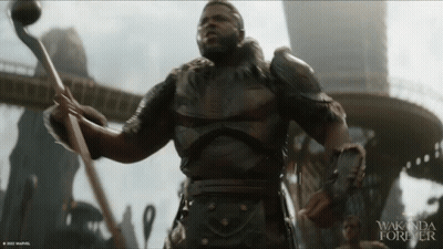 A Movie Poster For Wakanda Forever With A Man In Armor GIF