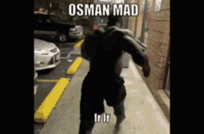 A Muscular Man Is Running Down A Sidewalk With A Caption That Says ' Osman Mad ' GIF