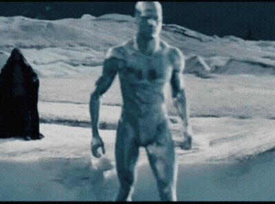 A Naked Man Standing In A Snowy Field GIF