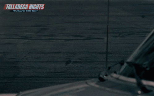 A Naked Man Stands In Front Of A Race Car With The Words Talladega Nights On The Bottom GIF