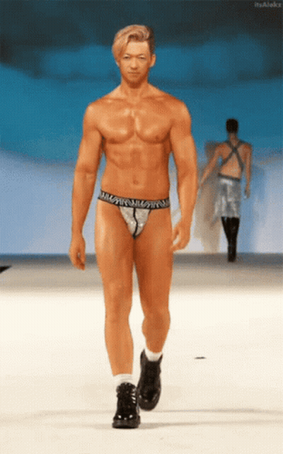 A Naked Man Walks Down A Runway Wearing A Thong That Says ' William ' On It GIF