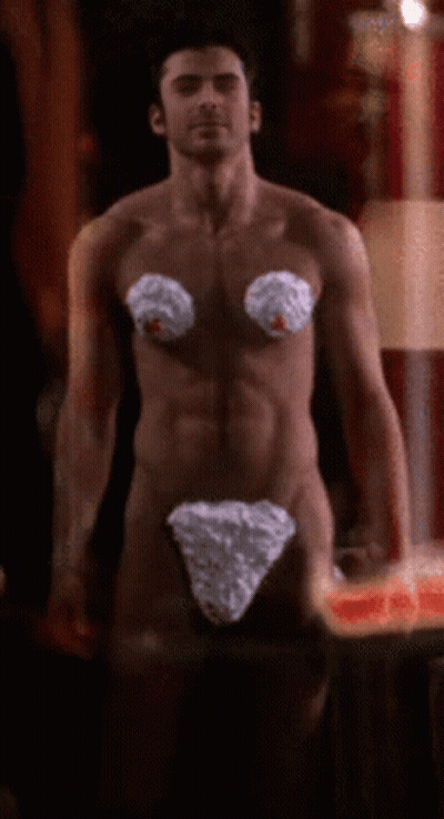 A Naked Man With Whipped Cream On His Breasts GIF
