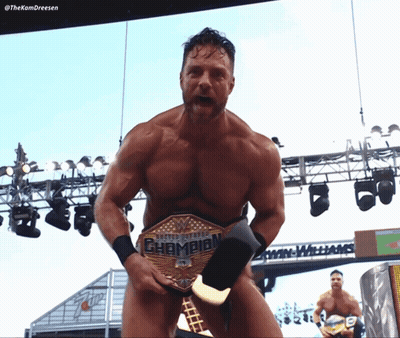 A Naked Wrestler Holding A United States Champion Belt GIF