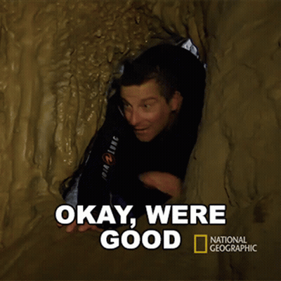 A National Geographic Poster With A Man In A Cave GIF
