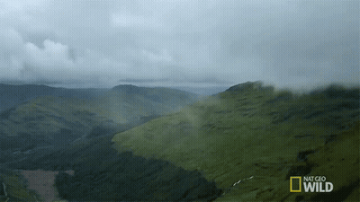 A National Geographic Wild Ad Shows A Landscape Of Mountains GIF