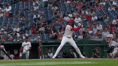 A Nationals Baseball Player Is About To Swing At A Ball GIF
