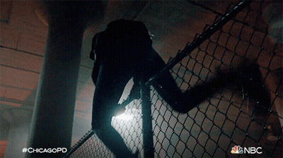 A Nbc Ad For Chicagopd Shows A Man Climbing A Fence GIF