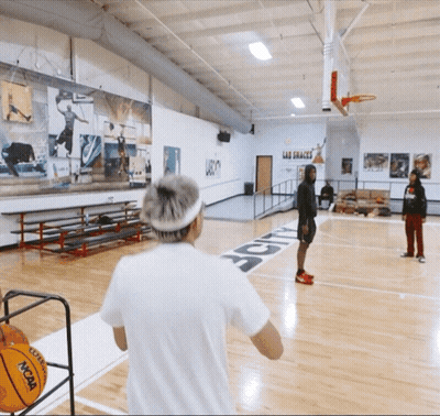 A Ncaa Basketball Is Being Thrown On The Court GIF
