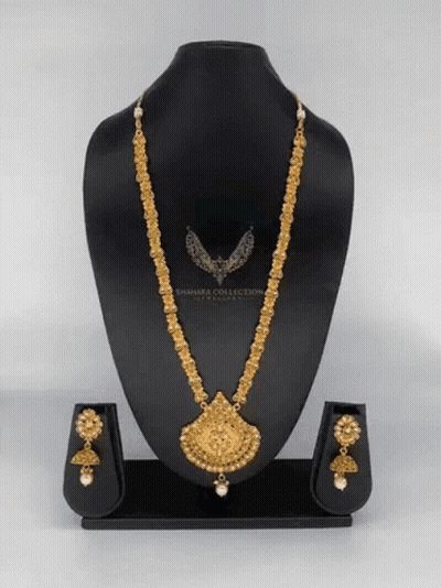 A Necklace And Earring Set Is On A Mannequin With The Word Sahara Collection On It GIF