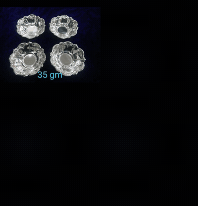 A Necklace And Earrings Are Displayed On A Black Velvet Shelf GIF