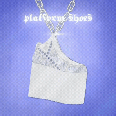 A Necklace That Looks Like A Pair Of Platform Shoes On A Chain . GIF