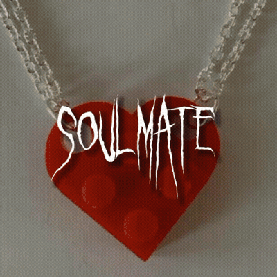A Necklace With A Red Heart And The Words Soulmate GIF