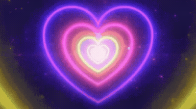 A Neon Heart Is Glowing In The Dark On A Dark Background GIF