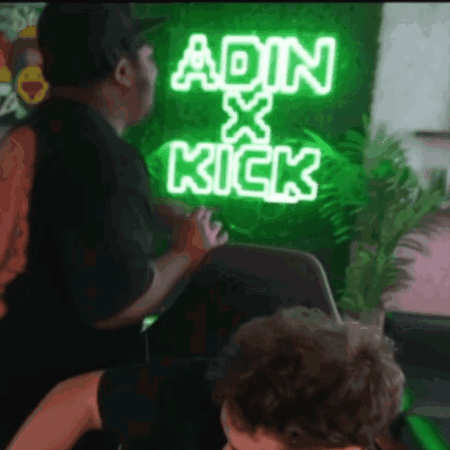 A Neon Sign That Says Ain X Kick Is Lit Up GIF