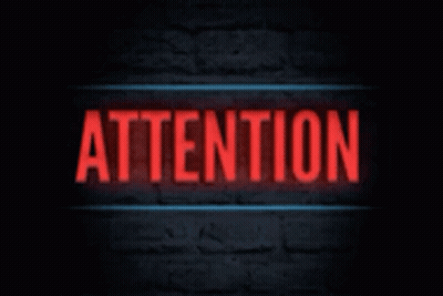 A Neon Sign That Says Attention On A Black Background GIF