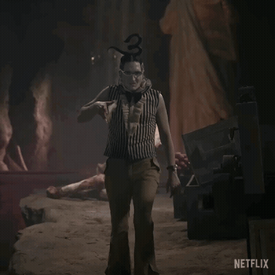 A Netflix Ad Shows A Clown Holding A Large Sword GIF