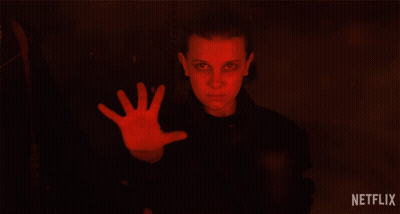 A Netflix Ad Shows A Girl With A Red Hand Reaching Out GIF