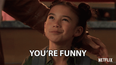 A Netflix Ad Shows A Little Girl Smiling And Saying " You 'Re Funny " GIF