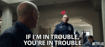 A Netflix Ad Shows A Man Talking To Another Man GIF