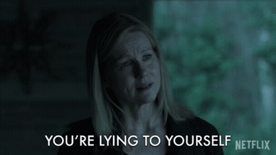 A Netflix Ad Shows A Woman Crying And The Words " You 'Re Lying To Yourself " GIF