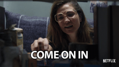 A Netflix Ad Shows A Woman Pointing At Something GIF