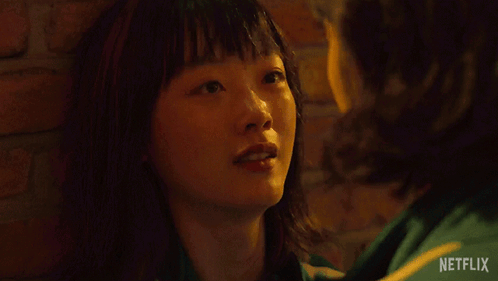 A Netflix Ad Shows A Woman Smiling And The Words Go To Jeju Island GIF