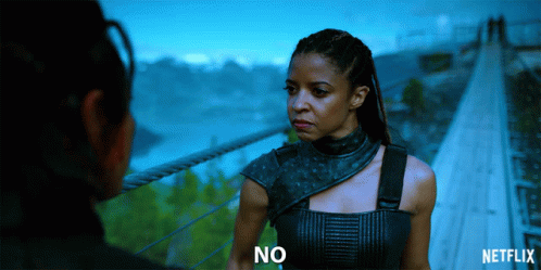 A Netflix Ad Shows A Woman Standing Next To Another Woman GIF