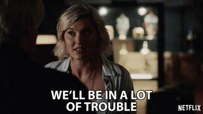 A Netflix Ad Shows A Woman Talking To Another Woman GIF