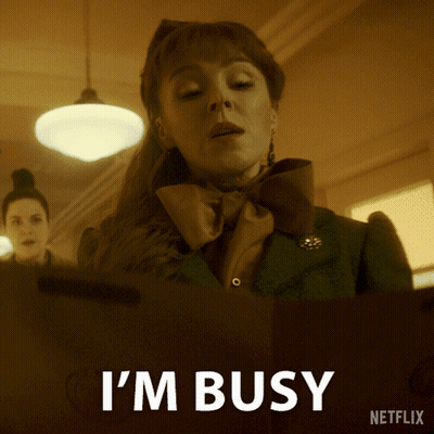 A Netflix Ad Shows A Woman With A Bow Tie And The Words I 'M Busy GIF
