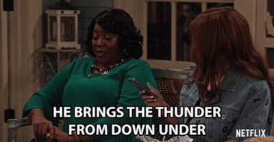 A Netflix Ad Shows Two Women Sitting On A Porch With The Caption He Brings The Thunder From Down Under GIF