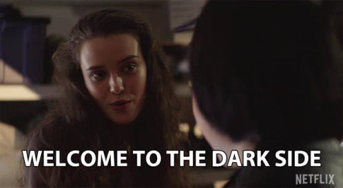 A Netflix Advertisement Shows A Woman Smiling And Says Welcome To The Dark Side GIF