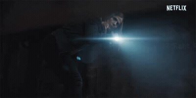 A Netflix Logo Is Displayed In The Dark GIF