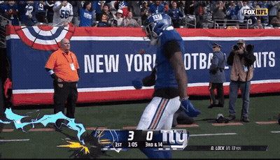 A New York Giants Football Player Runs On The Field GIF