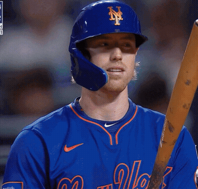 A New York Mets Baseball Player Holds A Bat GIF