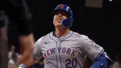 A New York Mets Baseball Player Is Wearing A Helmet And A Jersey . GIF