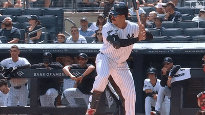 A New York Yankees Baseball Player Getting Ready To Swing At A Pitch GIF