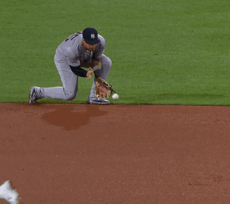 A New York Yankees Baseball Player Reaches For The Ball GIF