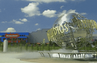 A Nickelodeon Building With A Globe In Front GIF